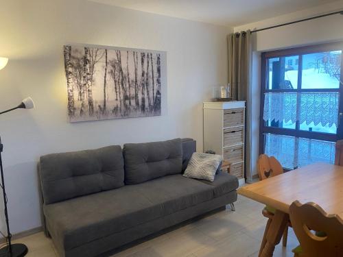 a living room with a couch and a table at Ferienwohnung Buchenhöhe in Berchtesgaden
