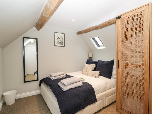 Кровать или кровати в номере Stable Cottage