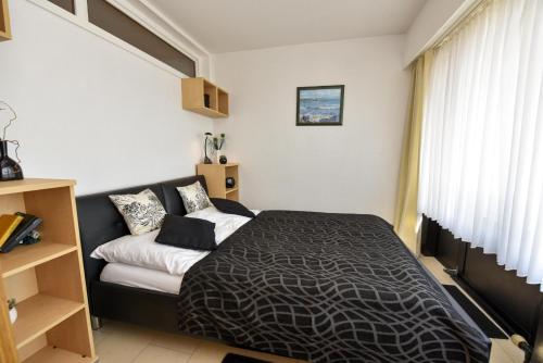 Een bed of bedden in een kamer bij Haus "Jan am Strand" Appartement JAN416