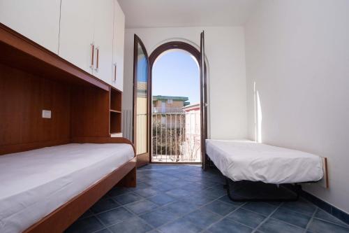 Ένα ή περισσότερα κρεβάτια σε δωμάτιο στο M290 - Marcelli, nuovo trilocale con terrazzo