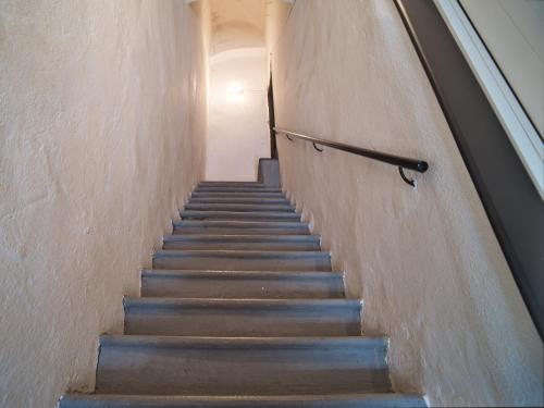a flight of stairs in a building at Medusa Apartment - Piazza 1 in Finale Ligure