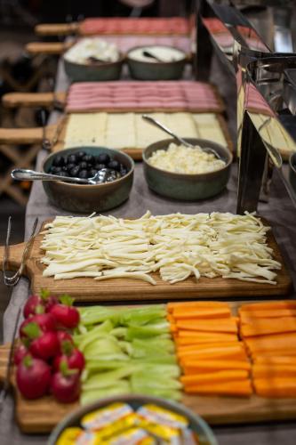 a buffet of food with vegetables and other foods at DiliJazz Hotel & Restaurant in Dilijan