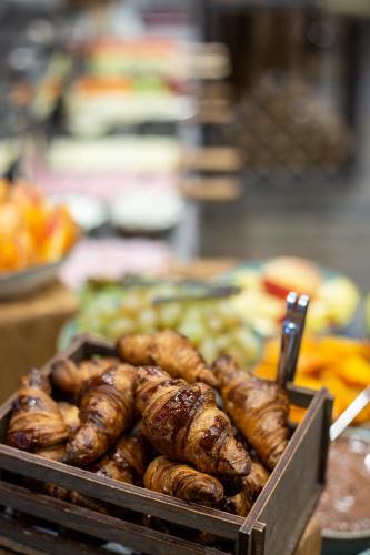 a tray of sausages and other food on a table at DiliJazz Hotel & Restaurant in Dilijan