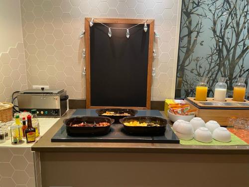 two bowls of food on a counter in a kitchen at Holiday Inn Paris-Auteuil by IHG in Paris