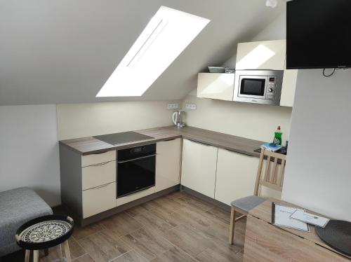 Kuchyň nebo kuchyňský kout v ubytování Apartmán Frymburk 700
