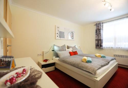 Un pat sau paturi într-o cameră la Appartement Anton