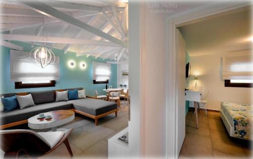 a living room with a couch and a table at Castristudios in Nikiti