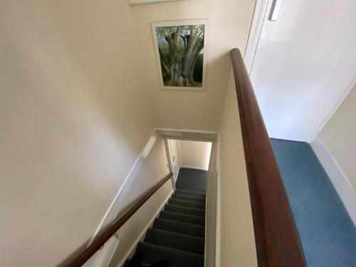 a stairway with a picture of a person on it at The Durbeyfield Guest House in West Bay