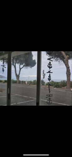 a view of a window with a skateboard on a street at Matteo's House Taormina in Taormina