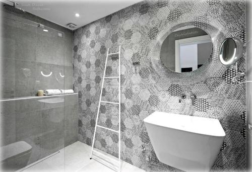 a bathroom with a sink and a mirror at Castristudios in Nikiti