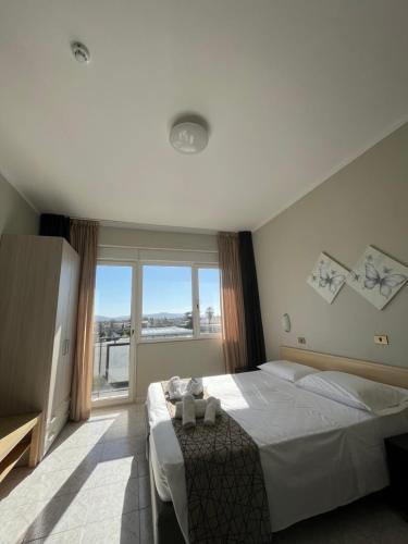 Postel nebo postele na pokoji v ubytování Hotel Letizia