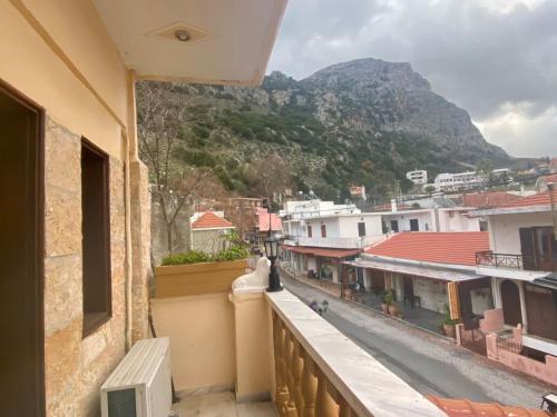 a view from a balcony of a city with a mountain at Costas Inn in Spílion