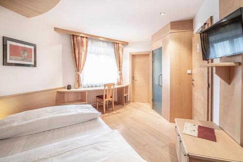 Postel nebo postele na pokoji v ubytování Posthotel Lamm