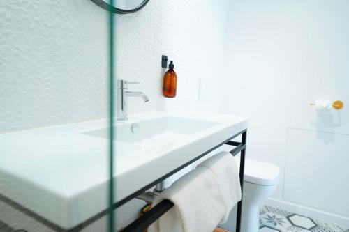 a bathroom with a sink and a toilet at B&B La Maison Galiène in Bordeaux