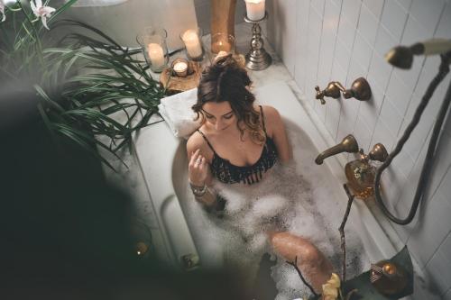a woman taking a bath in a bath tub at Villa Desiderio TUSCANY in Pistoia