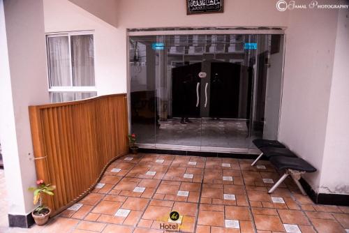 a hallway of a building with a mannequin in a window at Hotel Inn Hyderabad in Hyderabad