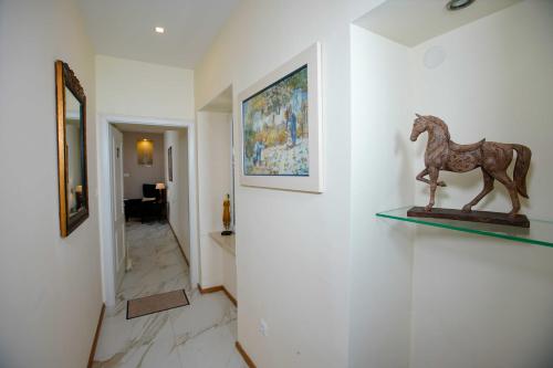 a statue of a horse on a shelf on a wall at Boutique Guest Accommodation Zephyrus in Split