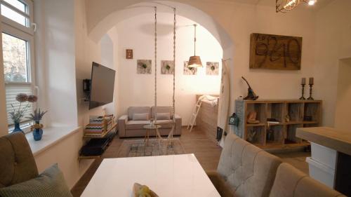 a living room with a couch and a table at Ap9210 in Pörtschach am Wörthersee