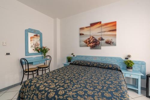 Ένα ή περισσότερα κρεβάτια σε δωμάτιο στο Hotel Quasar