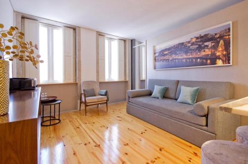 a living room with a couch and a table at National Theatre Flat in Porto