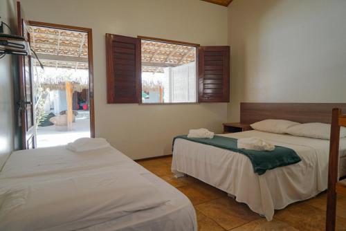 Cama ou camas em um quarto em Be Caju Hotel