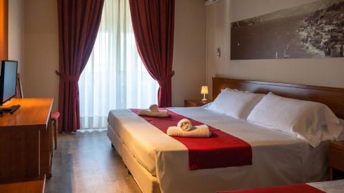 Ένα ή περισσότερα κρεβάτια σε δωμάτιο στο Hotel Venezia Park - ENJOY HOLIDAY