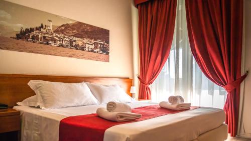 Ένα ή περισσότερα κρεβάτια σε δωμάτιο στο Hotel Venezia Park - ENJOY HOLIDAY