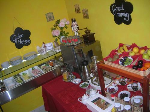 a table with a buffet of food in a room at Casa Andelka in Andělská Hora