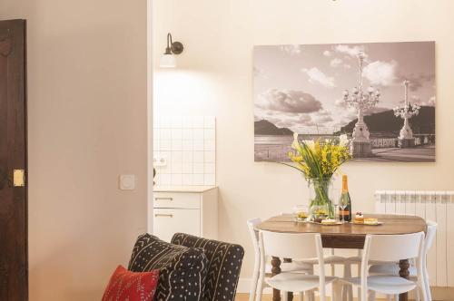 a dining room with a table and chairs at MARITXU'S HOME in Donostia-San Sebastián