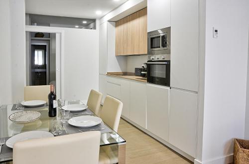 Kuchyň nebo kuchyňský kout v ubytování Apartamento de dos dormitorios en Triana