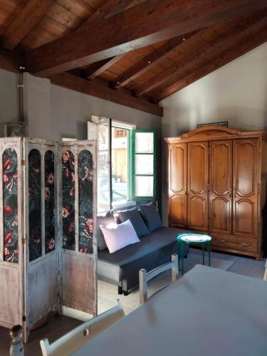 a living room with a couch and a wooden cabinet at Errekaondo in Areatza