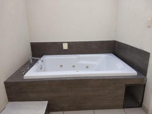 a large bath tub in a bathroom with at Hotel Guivá San Pablo in Hacienda Blanca