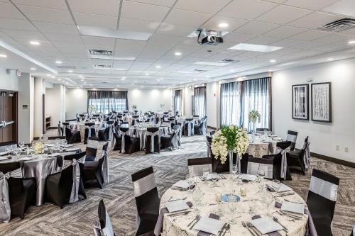 a banquet room with tables and chairs and tablesktop at Hyatt Place Hampton Convention Center in Hampton