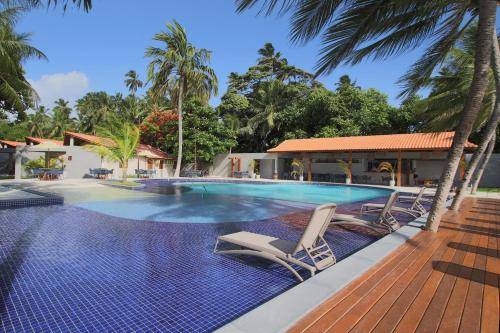 Bazén v ubytování Costa Dourada Village nebo v jeho okolí