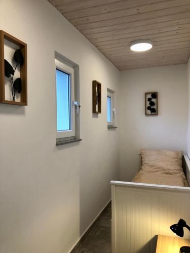 a room with a bed and a window at Erdgeschoss-Appartement mit Seeblick in Ahrensbök