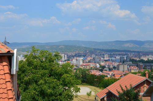 a view of a city with mountains in the background at Smeštaj - sobe MARVEL in Niš
