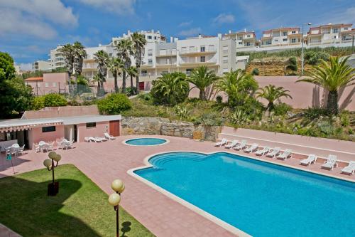 an image of a swimming pool at a resort at Ericeira Beach by AcasaDasCasas in Ericeira