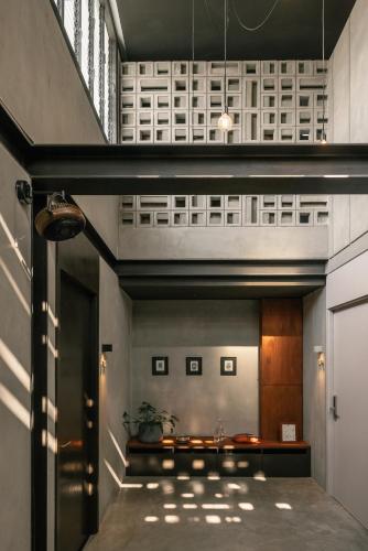 a hallway with a stairway leading to a building at Tamni in Bangkok