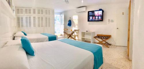 Postel nebo postele na pokoji v ubytování Hotel Downtown Merida