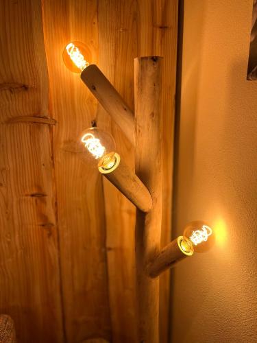 a group of lights hanging on a wall at Ferienwohnung-direkt-am-Skihang mit Sauna in Kurort Oberwiesenthal