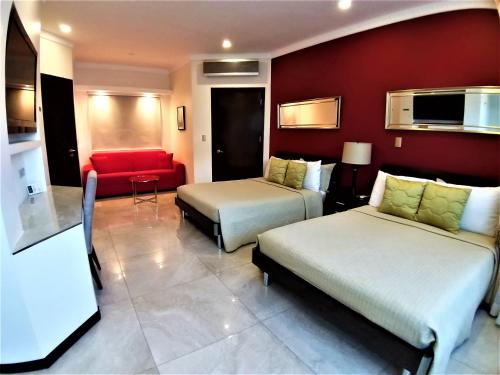 Postel nebo postele na pokoji v ubytování Alameda Cariari Boutique Hotel