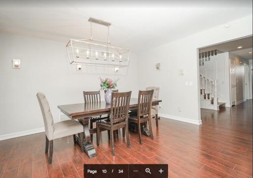 a dining room with a table and chairs at Valencia CA Stunning 3100 +sqft, 5Bed/5Bath home in Santa Clarita