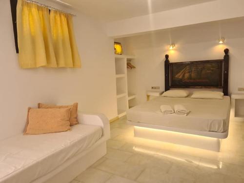 a bedroom with two beds in a room at Villa Danai in Agia Anna Naxos