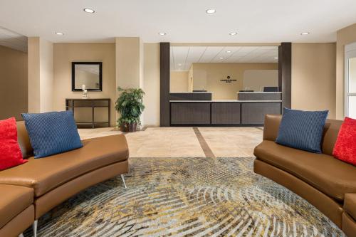 a lobby with two couches and a waiting room at Candlewood Suites - Safety Harbor by IHG in Safety Harbor