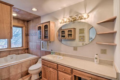 a bathroom with a sink toilet and a mirror at Buena Vista Oasis with Mtn Views, 3 Mi to Dtwn! in Buena Vista