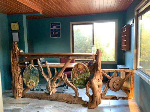 a room with a wooden table and a window at Hotel Ticozuma in Montezuma