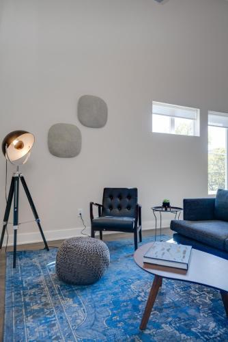 a living room with a couch and a table at Mason Lofts at West End in Nashville