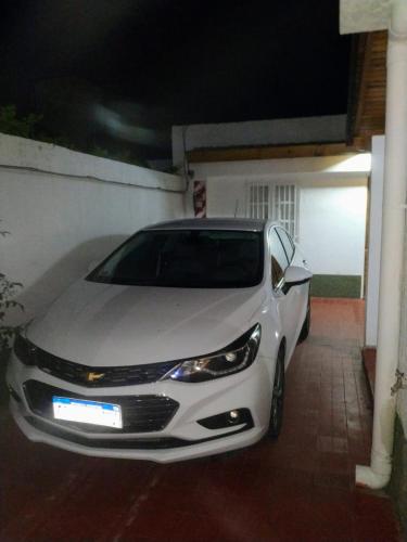 a white car parked in front of a house at MI CASA APARTS in Tunuyán