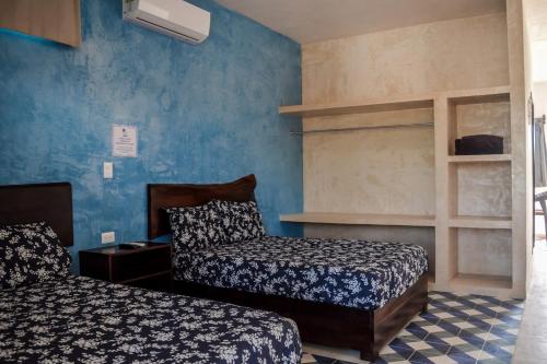เตียงในห้องที่ Apartamentos Del Mar El Cuyo