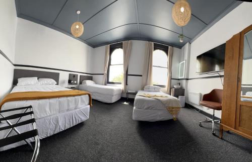 Letto o letti in una camera di Railway Hotel
